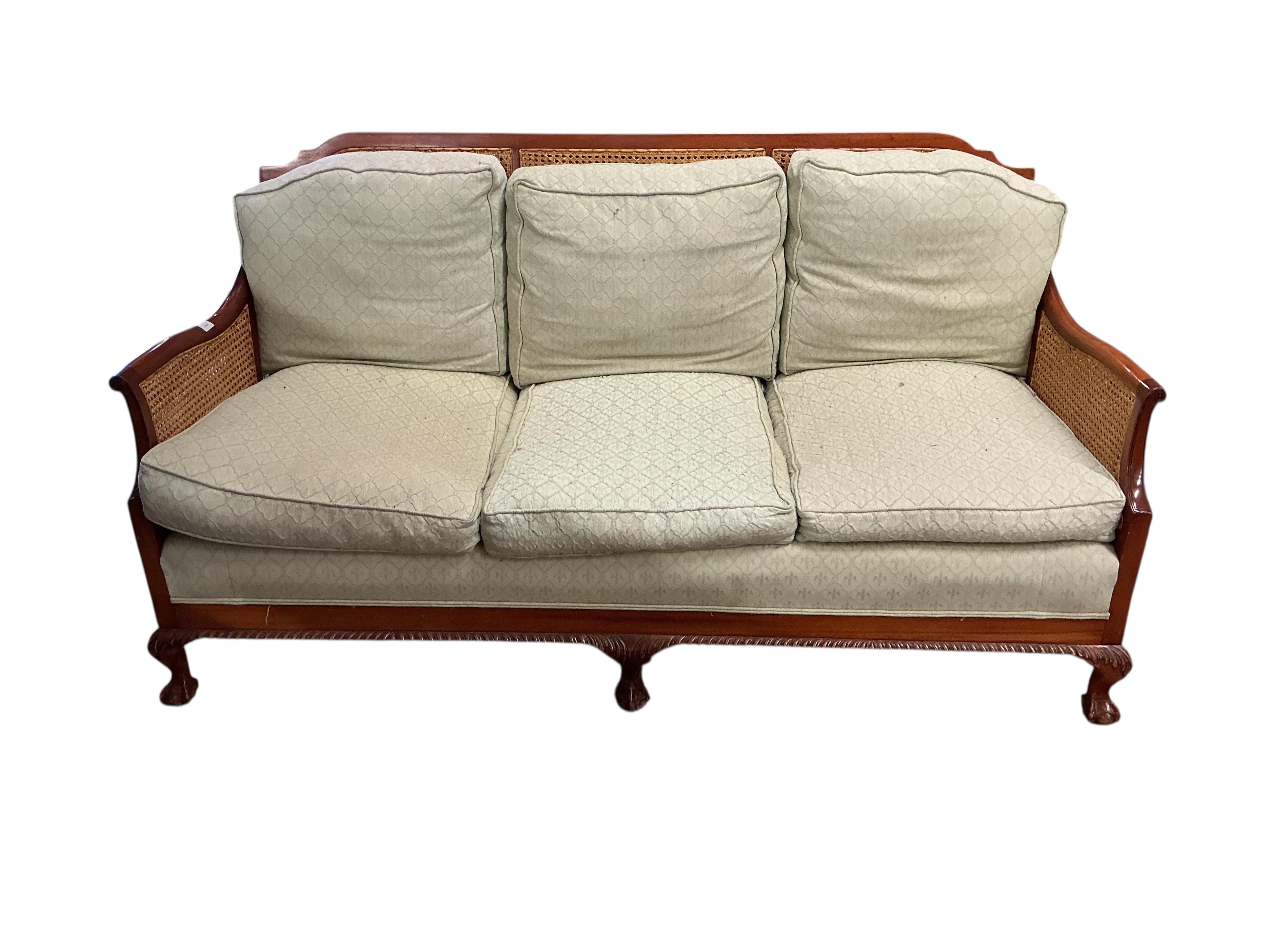 A mahogany double caned bergere settee with loose cushion seat and back, width 178cm, depth 78cm, height 87cm